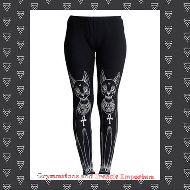 Black leggings with white print of Egyptian cat on legs