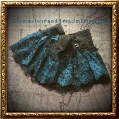 Handmade Steampunk cuffs in a teal/cyan blue and black lace